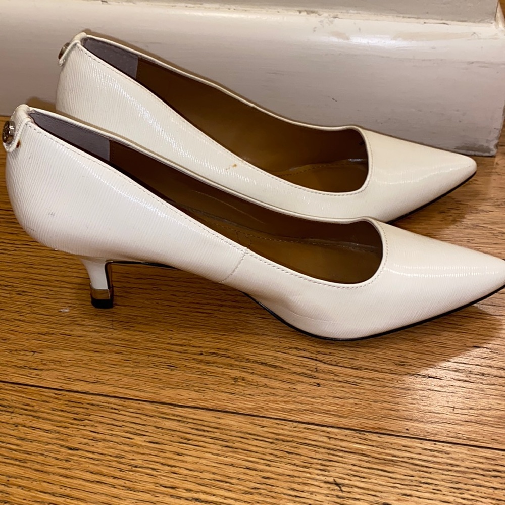 White leather high heels.